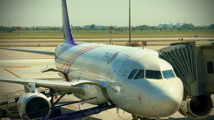 A Thai Airways plane at a gate at Bangkok's Suvarnabhumi Airport