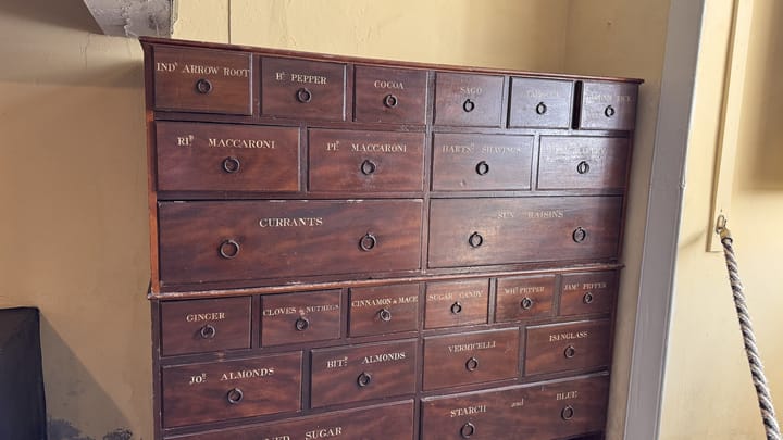 An old wooden cabinet of labelled drawers